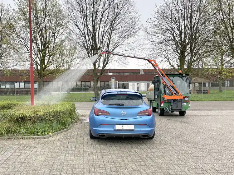 Tractor mounted watering arm